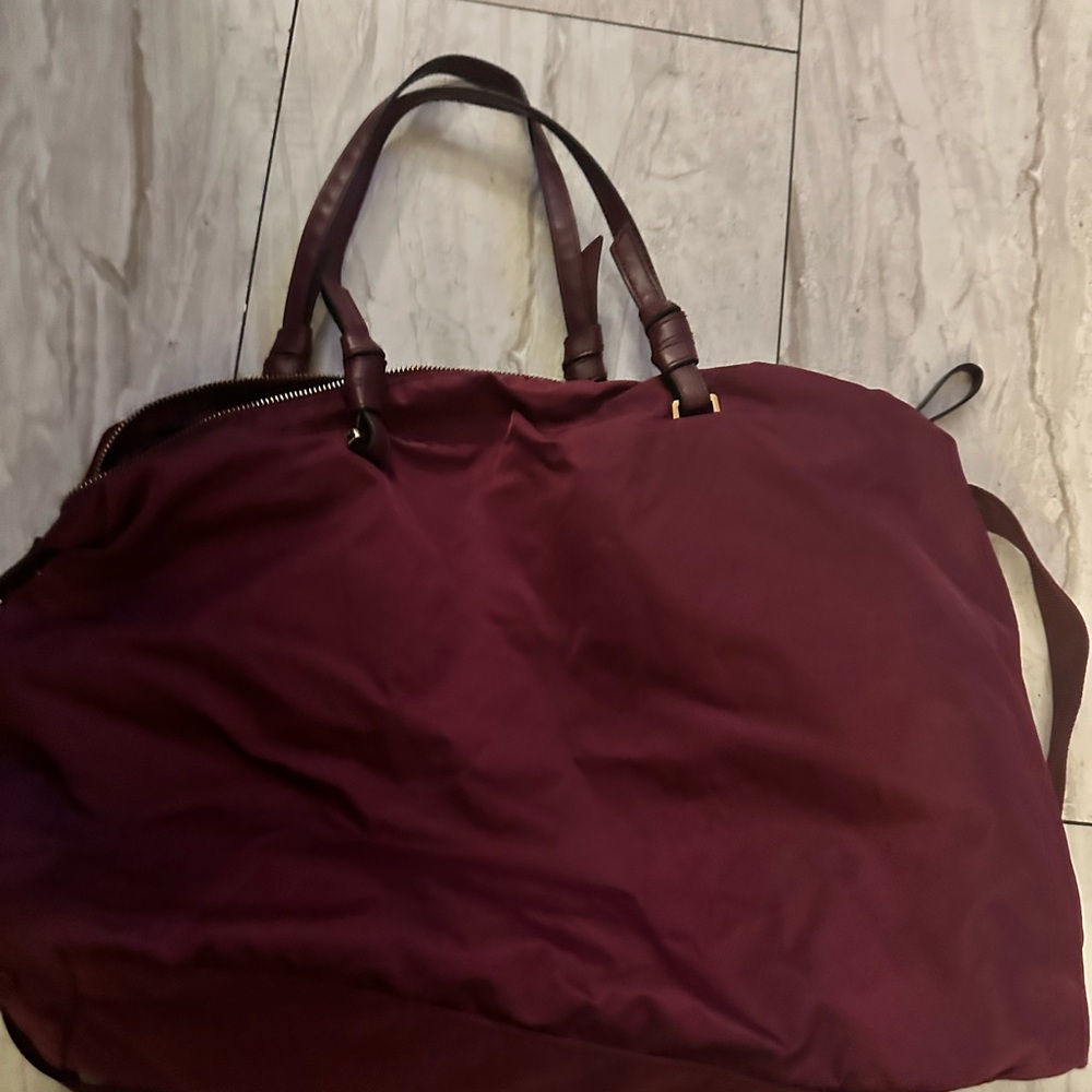 Brown Travel Bag with Leather Handles and Structured Base